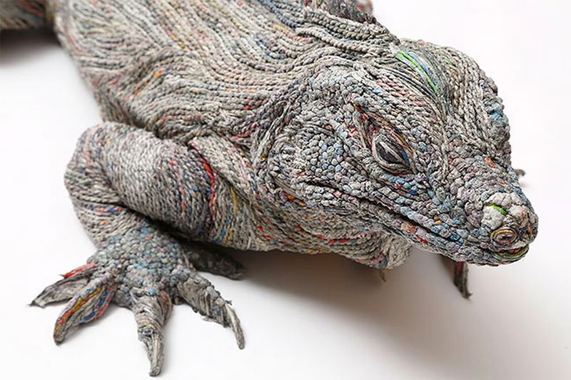 Realistic animal sculptures made from densely rolled newspapers