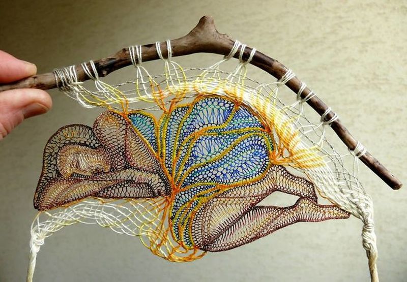 Hungarian artist composes figural lace artwork around pieces of wood