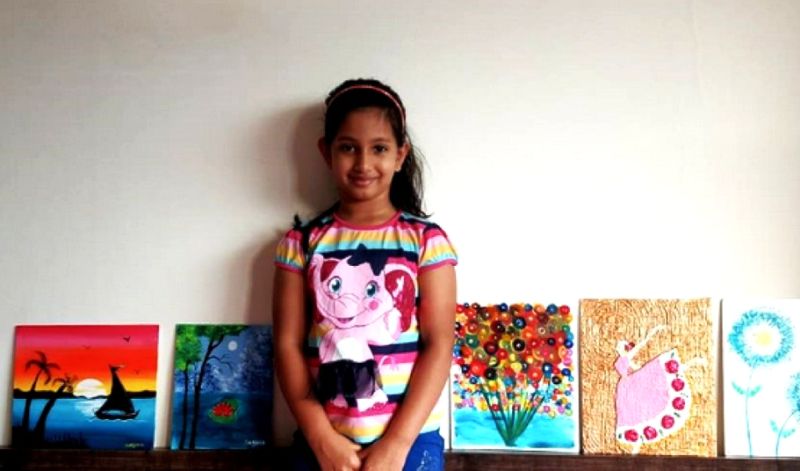 7-year-old girl sells her paintings to fund education for poor kids